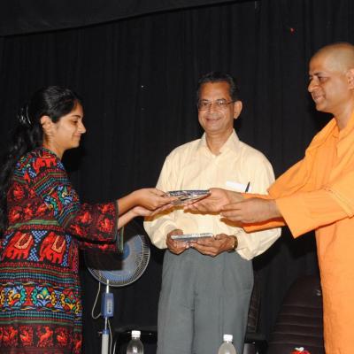 Swamiji Presenting The Books To Student Of Mop Vaishnava College