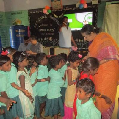 Nalini Dpf Distributing Sweets To The Children