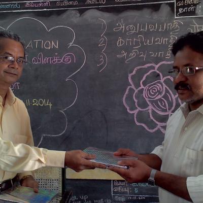 V.parthasarathy Managing Trustee Presenting Dpf Publications