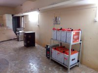 Local entrepreneurs operating solar-powered machinery