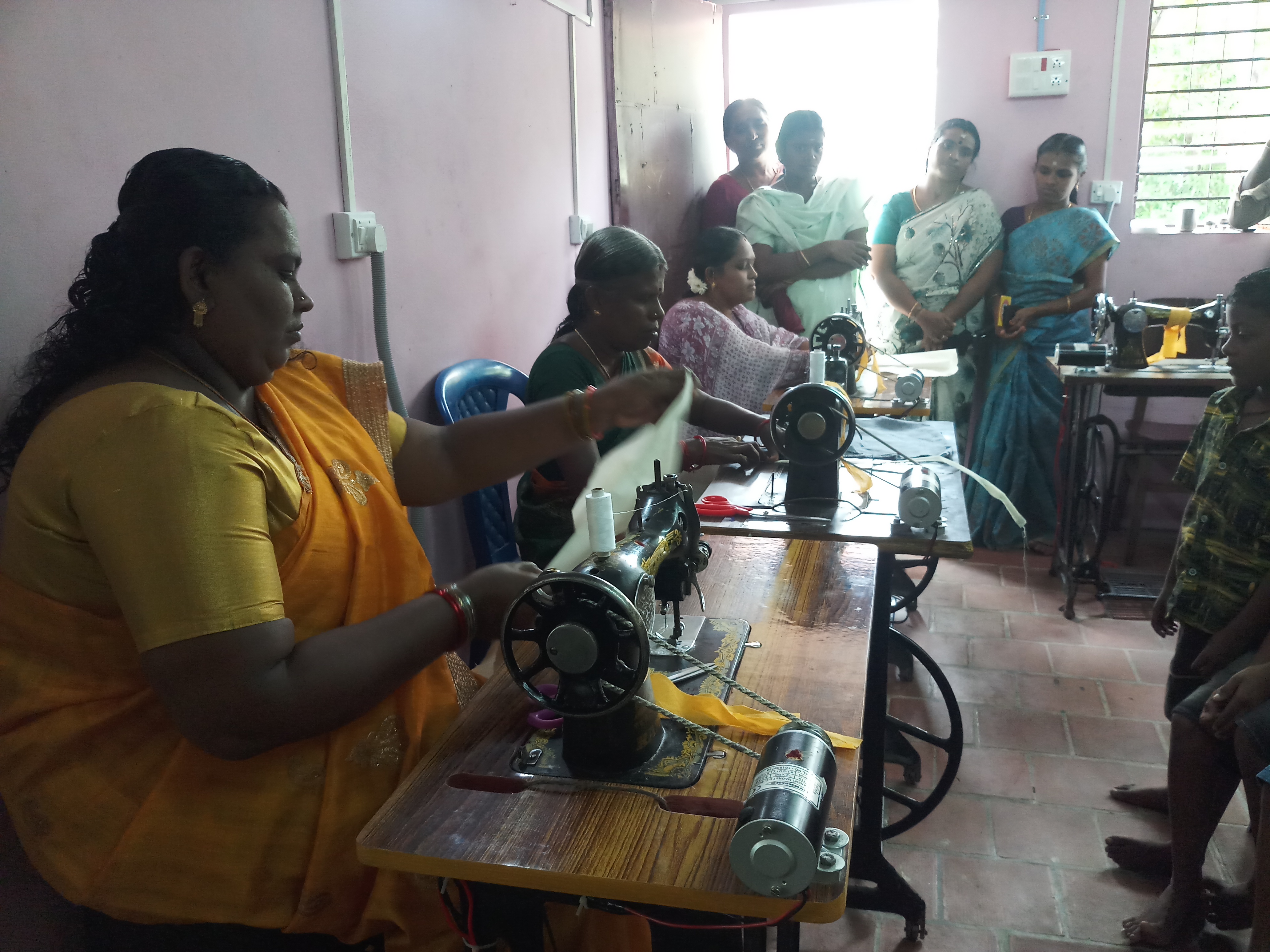 Women receiving tailoring training